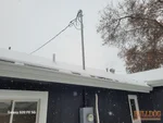 Unsupported 5-foot electrical service mast without guy wire at 52-year-old ranch in Spring Hill, KS — 66221 (38.7410N, 94.8277W)