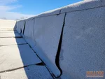 Open seams and alligator cracking on flat roof parapet wall in historic downtown Adrian, MO — 64720 (38.3972N, 94.3510W)