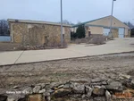 Exterior of 24-year-old commercial buildings in Highland Manor neighborhood of Independence, MO — 64051