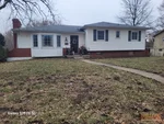 Exterior of 66-year-old raised ranch in White Oak Farms subdivision of Raytown, MO — 64138