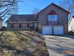 Exterior of 55-year-old raised ranch in Southwood Manor subdivision of Raytown, MO — 64138