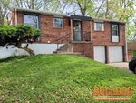 Exterior photo of 52-year-old vacant raised ranch inspected at 1017 NW Berkshire Dr, Blue Springs, MO 64015 (39.0288N, 94.2972W)