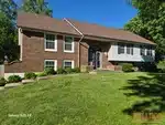 Exterior of 38-year-old split-level home in Country Club Gardens subdivision of Blue Springs, MO — 64014