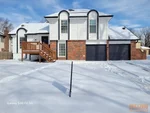 Exterior of 50-year-old 2-story in South View Manor subdivision of Grandview, MO – 64030 (38.9021N, 94.4995W)
