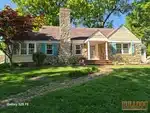 Exterior of 86-year-old reverse 1.5-story home in Golden Acres subdivision of Independence, MO — 64055