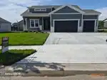 Exterior of new-construction reverse 1.5-story home in Huntford Phase 2 subdivision of Olathe, KS — 66061