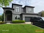 Exterior of 23-year-old 2-story home in Oxford Mills subdivision of Overland Park, KS — 66221