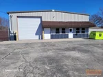 Commercial real estate inspector performing a structural assessment of a multi-building investment property in Harrisonville, MO.