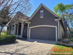 Exterior photo of 22-year-old reverse 1.5 story home inspected on E 72nd Terrace in Shawnee, KS 66227 (38.9965N, 94.8568W)