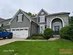Exterior of 25-year-old 2-story home in Clear Creek - The Forest subdivision of Shawnee, KS — 66218