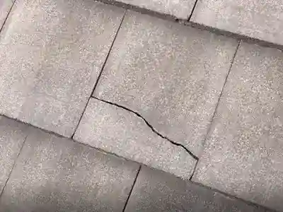 cracked concrete roof tile