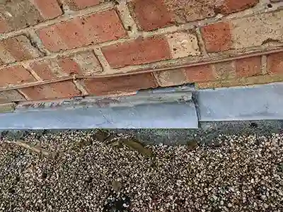 loose flashing leak at flat roof