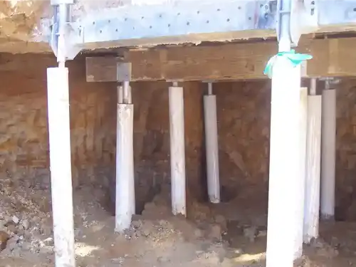 steel piers under poured concrete foundation