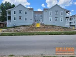 home-inspection-kansas-city-mo-11306-oak-st-64114-38.92119280N-94.58882000W-bulldog-home-inspections-06-25-2025 Exterior photo of 44-year-old vacant condo inspected at 11306 Oak St, Kansas City, MO 64114 (38.9212N, 94.5888W)