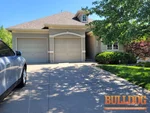 home-inspection-kansas-city-mo-12408-e-57th-st-39.018951N-94.435492W-bulldog-home-inspections-2025-06-19 Exterior photo of 23-year-old vacant reverse 1.5-story home inspected at 12408 E 57th St, Kansas City, MO (39.0190N, 94.4355W)
