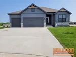 home-inspector-basehor-ks-1716-lolly-ct-66007-39.12553050N-94.95659830W-bulldog-home-inspections-2025-06-02 Exterior photo of vacant new construction reverse 1.5-story home inspected at 1716 Lolly Ct, Basehor, KS 66007 (39.1255N, 94.9566W)