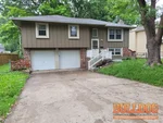 Exterior photo of 53-year-old vacant split-level home inspected at 517 N Park Dr, Belton, MO 64012 (38.8232N, 94.5391W)