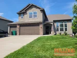 Exterior photo of 11-year-old vacant split level home inspected at 486 137th Pl, Bonner Springs, KS 66012 (39.0918N, 94.8967W)