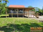 home-inspector-butler-mo-6120-nw-county-rd-1002-64730-38.23745940N-94.46285900W-bulldog-home-inspections-2025-05-14 Exterior photo of 60-year-old vacant 2-story home inspected at 6120 NW County Rd 1002, Butler, MO 64730 (38.2375N, 94.4629W)