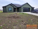 home-inspector-eudora-ks-345-w-25th-st-66025-38.91996510N-95.10176440W-bulldog-home-inspections-2025-06-12 Exterior photo of vacant new construction ranch inspected at 345 W 25th St, Eudora, KS 66025 (38.9200N, 95.1018W)