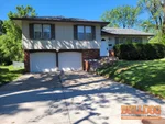 home-inspector-grandview-mo-12016-belmont-ave-64030-38.90547670N-94.52019010W-bulldog-home-inspections-2025-05-21 Exterior photo of 59-year-old vacant raised ranch inspected at 12016 Belmont Ave, Grandview, MO 64030 (38.9055N, 94.5202W)