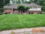 home-inspector-independence-mo-14601-e-44th-st-s-39.040142N-94.408287W-bulldog-inspections-2025-06-18 Exterior photo of a 58-year-old raised ranch-style home inspected at 14601 E 44th St S, Independence, MO (39.0401N, 94.4083W)