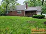 home-inspector-kansas-city-mo-5144-ne-marvin-rd-64118-39.18748390N-94.56571740W-bulldog-home-inspections-2025-05-20 Exterior photo of 80-year-old occupied 1.5-story home inspected at 5144 NE Marvin Rd, Kansas City, MO 64118 (39.1875N, 94.5657W)