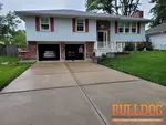 home-inspector-kansas-city-mo-6912-nw-79th-terr-64152-39.23890440N-94.66001540W-bulldog-home-inspections-2025-05-27 Exterior photo of 58-year-old occupied split-level home inspected at 6912 NW 79th Terr, Kansas City, MO 64152 (39.2389N, 94.6600W)