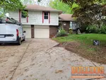 home-inspector-kansas-city-mo-9722-woodland-ln-64131-38.95026930N-94.56929220W-bulldog-home-inspections-04-30-2025 Exterior photo of 57-year-old vacant raised ranch inspected at 9722 Woodland Ln, Kansas City, MO 64131 (38.9503N, 94.5693W)