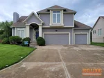home-inspector-lees-summit-mo-5912-ne-hidden-valley-dr-64064-39.02051710N-94.36985240W-bulldog-home-inspections-2025-06-07 Exterior photo of 23-year-old occupied split-level home inspected at 5912 NE Hidden Valley Dr, Lee's Summit, MO 64064 (39.0205N, 94.3699W)