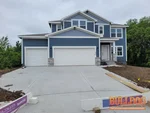 Exterior photo of vacant new construction 2-story home inspected at 607 Mayfair Ct, Raymore, MO 64083 (38.8271N, 94.4620W)