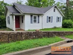 home-inspector-riverside-mo-4001-nw-south-dr-64150-39.18147820N-94.62738080W-bulldog-home-inspections-2025-06-03 Exterior photo of 90-year-old vacant ranch inspected at 4001 NW South Dr, Riverside, MO 64150 (39.1815N, 94.6274W)