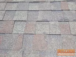 A photo of hail damage on the roof of a 33-year-old split level home in the Persimmon Hill subdivision of Olathe, KS (38.8949N, 94.8660W)