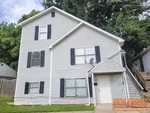 home-inspector-kansas-city-mo-5930-5932-agnes-ave-64130-38.84603480N-94.35432470W-bulldog-home-inspections-20250724_101852 Exterior of vacant 34-year-old duplex at 5930–5932 Agnes Ave, Kansas City, MO — 64130 (38.8460N, 94.3543W)