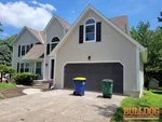 home-inspector-lees-summit-mo-1025-ne-remington-ct-64086-38.93015000N-94.33130500W-bulldog-home-inspections-20250722_133601 Exterior of vacant 38-year-old 2-story home at 1025 NE Remington Ct, Lee's Summit, MO — 64086 (38.9301N, 94.3313W)