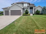 home-inspector-overland-park-ks-15716-canterbury-st-66224-38.84506660N-94.62352350W-bulldog-home-inspections-20250708_101800 A photo of a vacant 7-year-old 1.5-story home in the Watersedge subdivision of Overland Park, KS (38.8451N, 94.6235W)