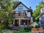 Exterior of 117-year-old up-down 2-story duplex in Mellier Place subdivision of Kansas City, MO — 64111 (39.054987N, 94.602089W)