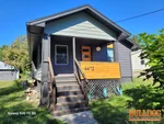 Exterior of 105-year-old bungalow in Winnwood Beach subdivision of Kansas City, MO — 64117 (39.1739N, 94.5309W)