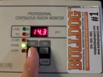 radon-testing-de-soto-ks-31150-w-102nd-st-66018-38.94418820N-94.94663680W-bulldog-home-inspections-20250830_175415 Radon detector showing high level (14.3 pCi/L) at 47‑year‑old ranch home in De Soto, KS — 66018 (38.9442° N, 94.9466° W)
