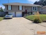 Exterior of 46-year-old split-level home in Blue Springs Manor South subdivision of Blue Springs, MO — 64014 (39.0046N, 94.2582W)
