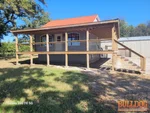 Exterior of 60-year-old 1.5-story home near Battle of Island Mound subdivision in Butler, MO — 64730 (38.2375N, 94.4629W)