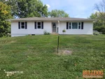 Exterior of 58-year-old ranch in Village South subdivision of Harrisonville, MO — 64701 (38.6454N, 94.3410W)