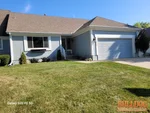 Exterior of 29-year-old townhome in The Villas subdivision of Kansas City, MO — 64138 (39.0665N, 94.8849W)