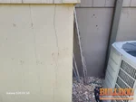 Vertical exterior foundation crack on 17-year-old home in Rosewood Hills subdivision of Grain Valley, MO — 64029 (39.0408N, 94.2074W)