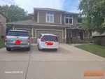 Exterior of 19-year-old two-story in Preston Meadows subdivision of Lee’s Summit, MO — 64086 (38.9368N, 94.3456W)