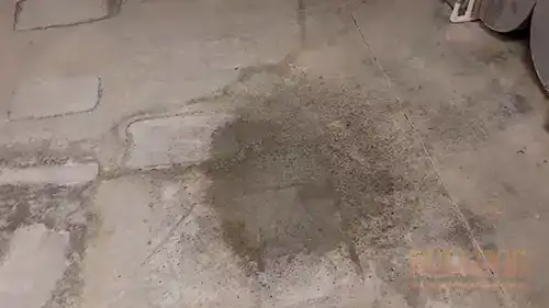 Water pooling on basement concrete floor from guest bathroom sink leak - Windsor Hills, Overland Park, KS