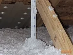 blown-fiberglass-insulation-in-attic-raymore-mo-117-s-westglen-dr-64083-38.80254170N-94.47782330W-bulldog-home-inspections-20251205_141140 Blown fiberglass insulation in attic of 8-year-old split-level home in Eagle Glen subdivision of Raymore, MO — 64083 (38.8025N, 94.4778W)