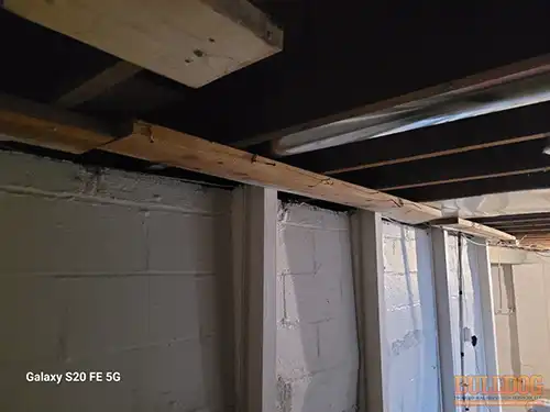 Inadequate I-beam top support with wood - Marlborough Heights, Kansas City, MO - December 2025 - foundation repair