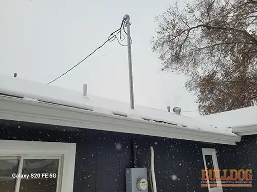 Bent electrical service mast without guy wire support - Spring Hill, KS - December 2024 - 52-year-old ranch