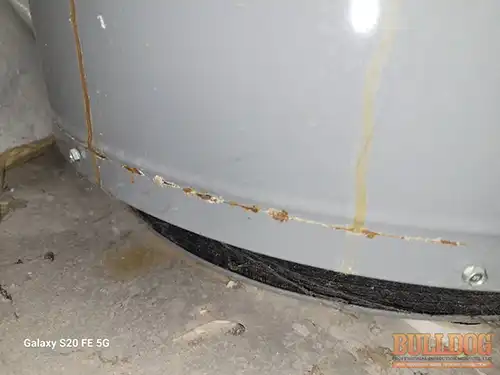 rust-at-base-of-water-heater-shawnee-ks-9154-shady-bend-rd-66227-38.96209850N-94.87648130W-bulldog-home-inspections-20251212_151734 Rust at base of water heater - Arbor Lake subdivision, Shawnee, KS - December 2025 - 9-year-old 2-story